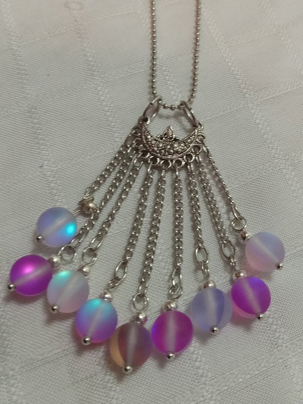 Exquisite handmade necklace featuring a half-moon-shaped Tibetan silver charm